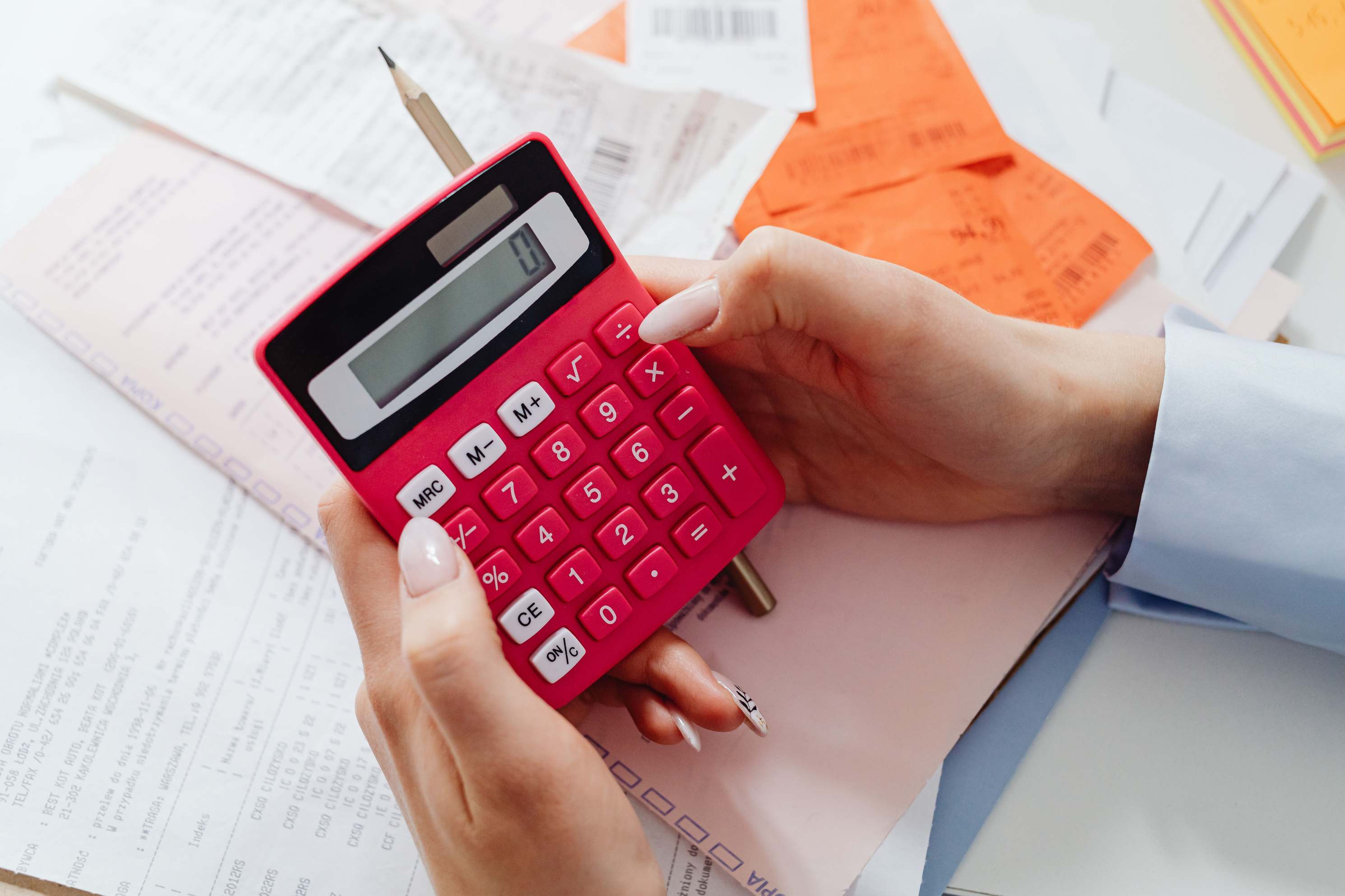 Receipts and documents with a calculator for managing finances
